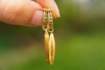 22k gold emerald hoops//gold leaf earrings//artisan emerald earrings//handmade gold hoops//22k emerald earrings//gold leaf hoops