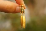 22k gold emerald hoops//gold leaf earrings//artisan emerald earrings//handmade gold hoops//22k emerald earrings//gold leaf hoops